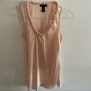 Sleeveless blouse with twisted neckline size small